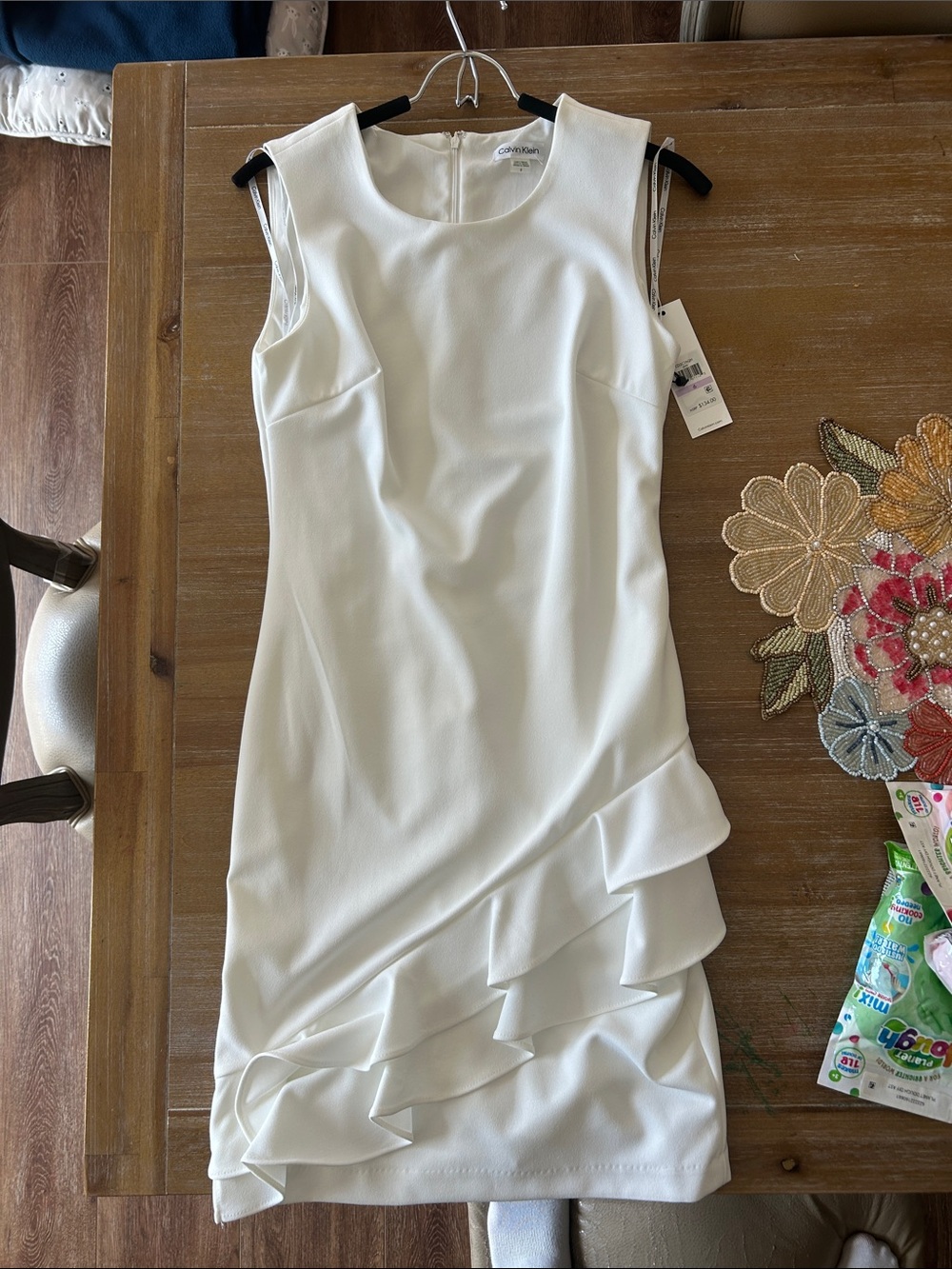 Calvin Klein Ivory Sleeveless Sheath Dress with Ruffle Hem